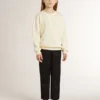 Girls’ cream-colored sweatshirt with patch writing