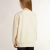 Girls’ cream-colored sweatshirt with patch writing