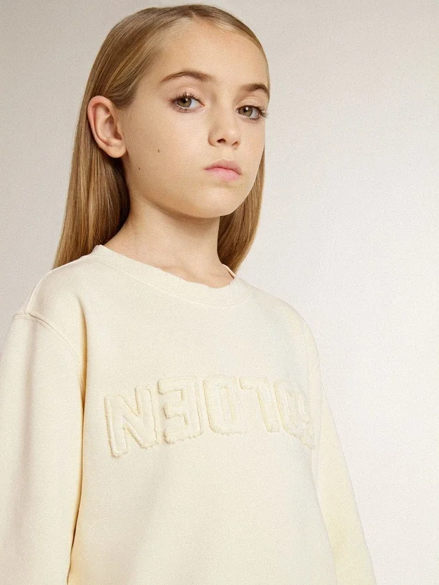 Girls’ cream-colored sweatshirt with patch writing