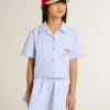 Girls' cropped shirt in striped light blue cotton