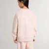 Girls' pink-colored sweatshirt with pink front lettering