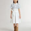 Girls’ shirt dress in white cotton canvas with a blue nautical print and white piping