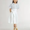 Girls’ shirt dress in white cotton canvas with a blue nautical print and white piping