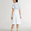 Girls’ shirt dress in white cotton canvas with a blue nautical print and white piping