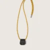 Glasses case with mustard-colored hiking lace and black leather clip