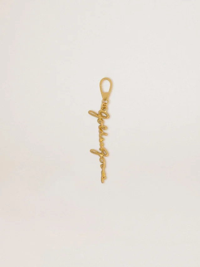 Gold-colored brass charm with Golden Goose signature