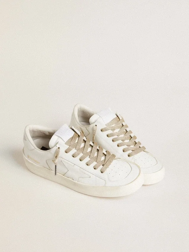 Gold-colored Lurex laces with contrasting white logo