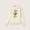 Golden girls’ sweater in white cotton yarn with mascot embroidery