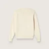 Golden girls’ sweater in white cotton yarn with mascot embroidery