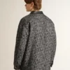 Gray herringbone jacket with black leather details