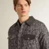 Gray herringbone jacket with black leather details