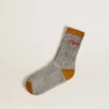 Gray ribbed socks with orange details and red logo