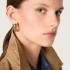 Hoop earrings with antique gold-colored studs