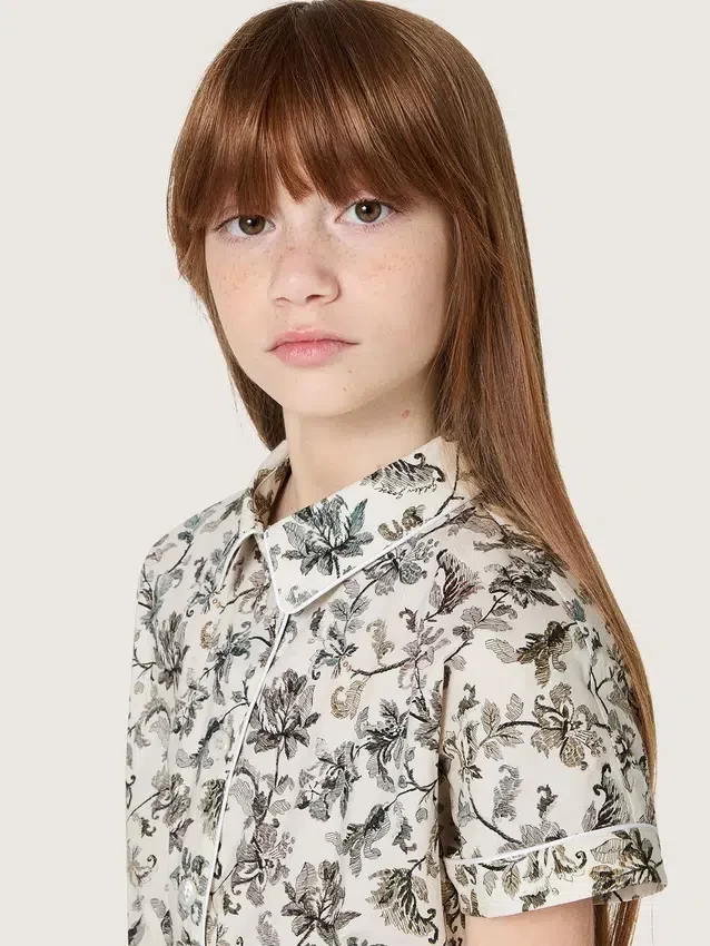 Journey girls’ dress in white cotton canvas with green floral print