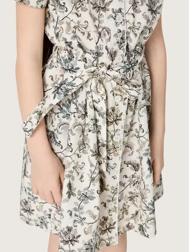 Journey girls’ dress in white cotton canvas with green floral print