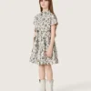 Journey girls’ dress in white cotton canvas with green floral print