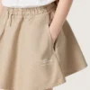 Journey girls’ miniskirt in beige cotton gabardine with print