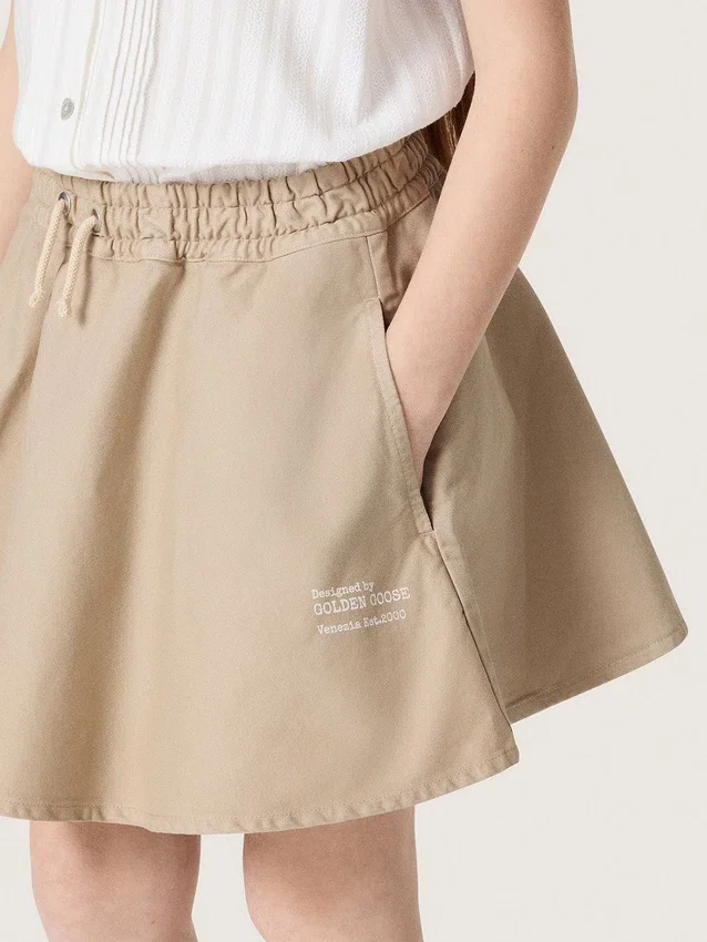 Journey girls’ miniskirt in beige cotton gabardine with print