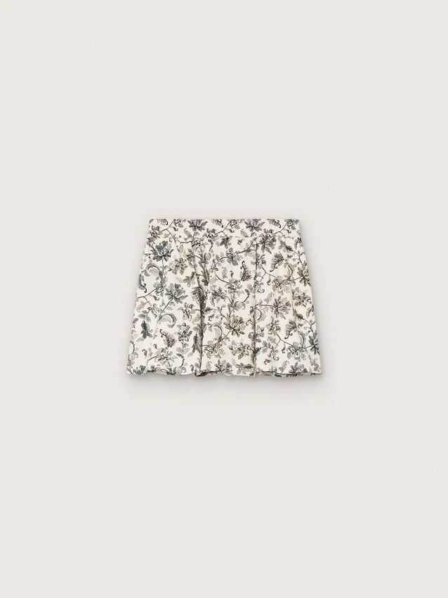 Journey girls’ miniskirt in white cotton canvas with green floral print