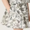 Journey girls’ miniskirt in white cotton canvas with green floral print
