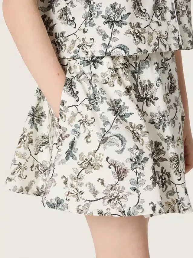 Journey girls’ miniskirt in white cotton canvas with green floral print