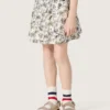Journey girls’ miniskirt in white cotton canvas with green floral print