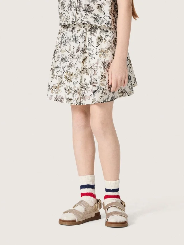 Journey girls’ miniskirt in white cotton canvas with green floral print