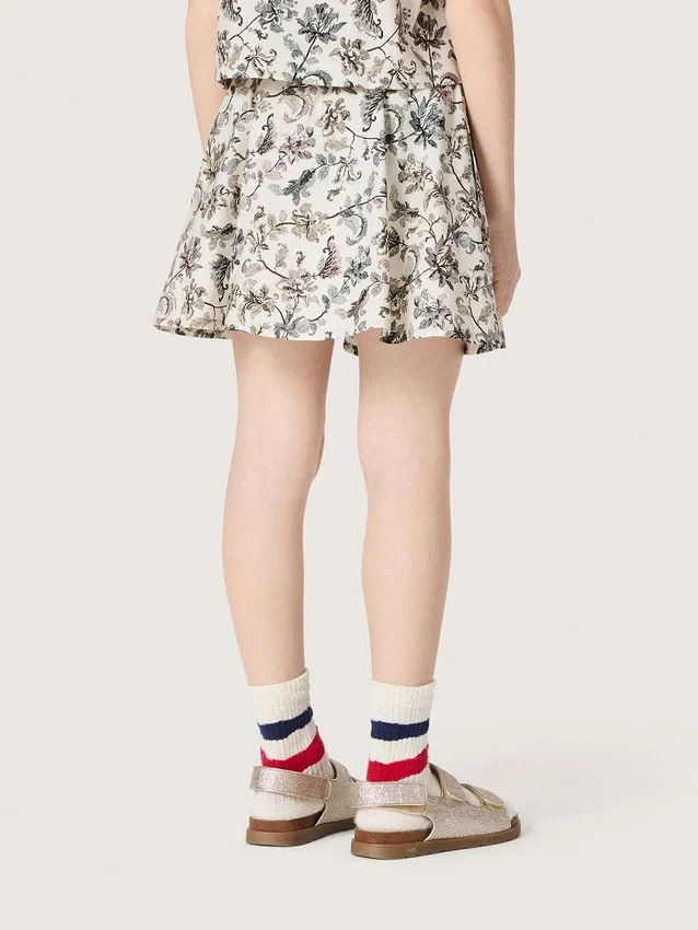 Journey girls’ miniskirt in white cotton canvas with green floral print