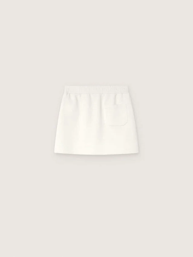 Journey girls’ miniskirt in white cotton fleece with crystals and embroidery
