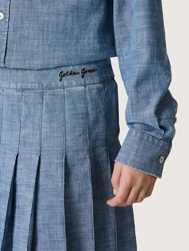 Journey girls’ pleated miniskirt in light blue cotton chambray with embroidered logo