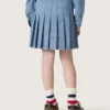 Journey girls’ pleated miniskirt in light blue cotton chambray with embroidered logo