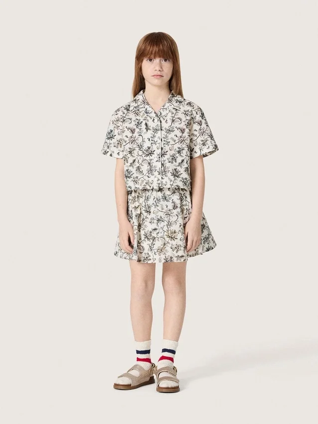 Journey girls’ miniskirt in white cotton canvas with green floral print