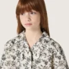 Journey girls’ short-sleeved shirt in white cotton canvas with a green floral print