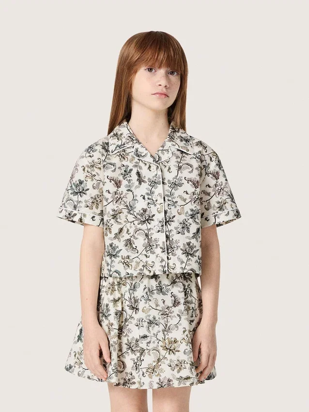Journey girls’ short-sleeved shirt in white cotton canvas with a green floral print