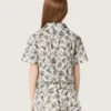 Journey girls’ short-sleeved shirt in white cotton canvas with a green floral print