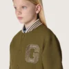 Journey unisex bomber jacket in military-green nylon twill with embroidered patch