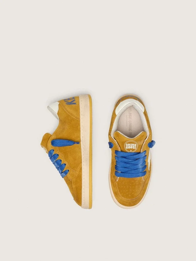 Junior Ball Star in ocher suede with glossy white leather star and heel tab