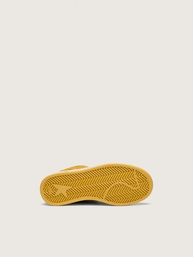 Junior Ball Star in ocher suede with glossy white leather star and heel tab