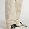 Junior Ball Star in white nappa with dark green suede inserts and black star