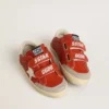 Junior Old School in orange nappa with white star and cream-colored leather heel tab
