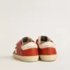 Junior Old School in orange nappa with white star and cream-colored leather heel tab