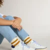 Junior Super-Star in white leather with blue suede heel tab
