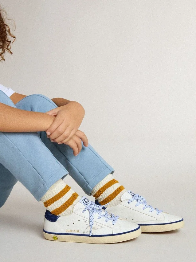 Junior Super-Star in white leather with blue suede heel tab