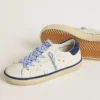 Junior Super-Star in white leather with blue suede heel tab