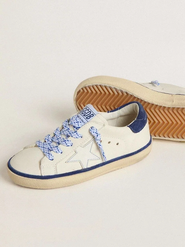 Junior Super-Star in white leather with blue suede heel tab