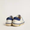 Junior Super-Star in white leather with blue suede heel tab