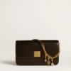 Key-shaped charm in gold-colored brass with crystals