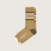 Khaki-colored socks with distressed details and dark green and white stripes