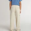 Kids’ beige chino pants with multicolor splashes