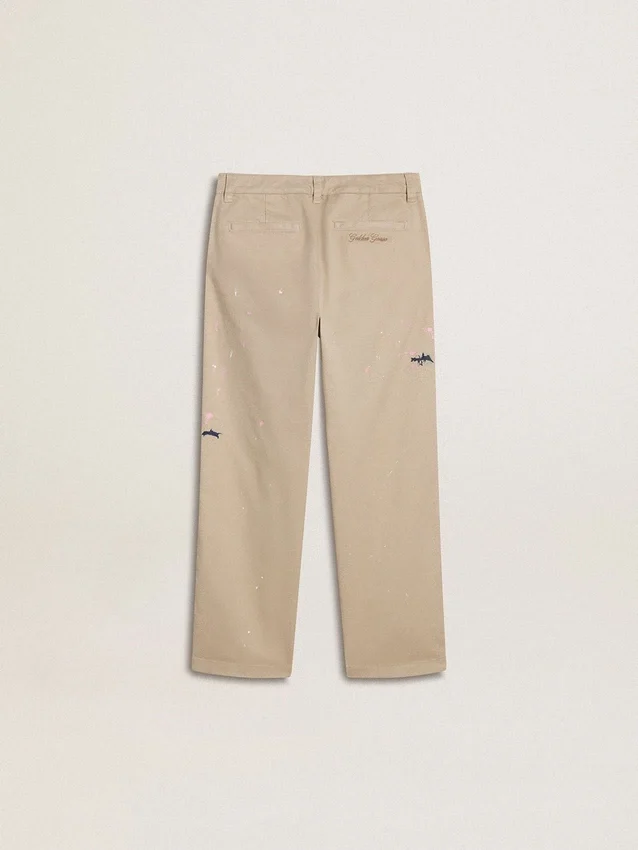 Kids’ beige chino pants with multicolor splashes